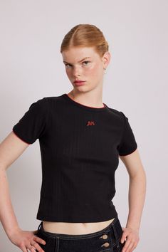 Our black pointelle shrunken tee features a black pointelle fabrication, red central DM embroidery and red contrast embroidered trim. •Heart pointelle design fabric •Short Sleeve •Red embroidery detailing •Select your normal size •100% Organic Cotton •Designed in London MODEL INFO: Model is 5'10 and is wearing a UK 10. Heart Pointelle, Madness Clothing, London Models, Perfect White Tee, Embroidery Detailing, Red Embroidery, Embroidered Trim, Skirt Co Ord, Red Gingham