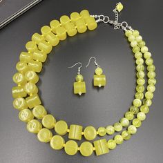 Brighten up any outfit with our Bold Neon Yellow Chunky Statement Necklace. This eye-catching multi-strand piece is handmade with vibrant neon yellow beads, making it a standout accessory perfect for adding a pop of color. Ideal as a unique birthday gift or a striking addition to your own jewelry collection, it's designed to turn heads and elevate your style. This is a handcrafted necklace, uniquely designed with attention to every detail. - Necklace length is 18" shortest strand plus additional Autumn Necklace, Chunky Statement Necklace, Yellow Necklace, Christmas Necklace, Tarnished Silver, Unique Birthday Gifts, Handcrafted Necklace, Halloween Jewelry, Neon Yellow