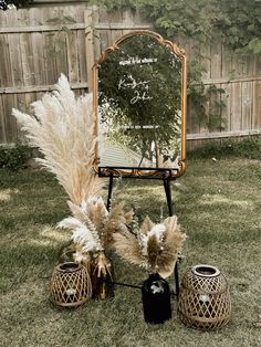 a mirror sitting on top of a grass covered field