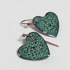 "Green on green crackle enamel hearts - minty grass green beauties.  .5\" by .5\". SOLID TITANIUM EARWIRES ARE AVAILABLE FREE UPON REQUEST - please message me. My enameled items are made with love using glass powder enamels on copper, kiln-fired to about 1500oF, and require many layers and firings. Backs are finished with enamel, and pieces are set with copper findings. I have been in the glassworking and jewelry-making trades since 1994 and have a deep love and respect for glass of any kind." Green Teardrop Enamel Jewelry, Hypoallergenic Green Enamel Jewelry, Green Jewelry With Black Enamel For Gift, Green Jewelry With Black Enamel As A Gift, Green Enamel Jewelry With Black Enamel, Green Heart-shaped Earrings For Gifts, Handmade Green Heart Earrings As Gift, Handmade Green Heart Earrings For Gift, Small Handmade Green Jewelry