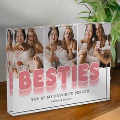 a photo block with the words besties on it and four women in white dresses