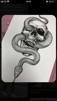 a drawing of a skull with a snake wrapped around it's head, on top of a piece of paper