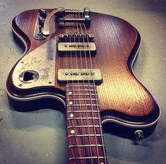 an electric guitar sitting on top of a table