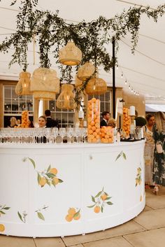 White circular bar covered in oranges and wicker lanterns. Portable Bar Ideas, Summer 2023 Wedding, Food Festivals Event, Bar Hire, Reception Bar, Amalfi Coast Wedding, Event Bar, Bar Inspiration, Portable Bar