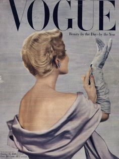 an old fashion magazine cover with a woman in a dress and gloves on the cover