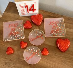 valentine's day decorations are displayed on a table