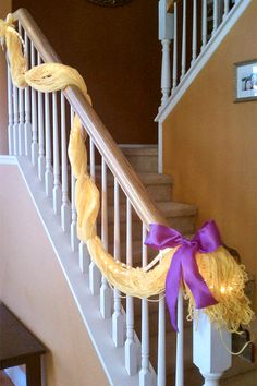 there is a purple ribbon on the banister