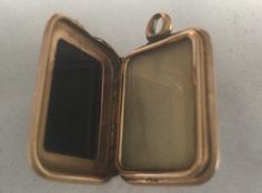 "This locket was used as a watch fob in the 1800's. It has a  rectangular dark Carnelian stone on one side, and on the other side is Sardonyx stone. It is hard to  see the dark orange Carnelian in the photo.  This lovely antique fob locket  can also be used as a pendant, a charm on a bracelet.The locket opens up and you can put two small pictures in it. It has been tested and it is 14 karat rose gold. It had some wear on the edges of the stones , and a small shiny piece on one side. It measures Victorian Rectangular Locket Jewelry, Victorian Style Rectangular Locket Jewelry, Vintage Rectangular Locket Jewelry, Antique Bronze Rectangular Jewelry, Antique Rectangular Bronze Jewelry, Sardonyx Stone, Rose Gold Locket, Poison Ring, Victorian Locket