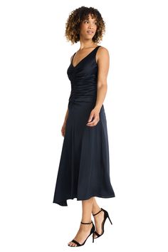 Meet Carmie, a stunning midi dress crafted from luxurious heavy charmeuse. The sleek silhouette features elegant ruching at the bodice and a flowing asymmetrical hemline. Perfect for cocktail parties evening galas or upscale dinners. Pair with statement earrings and strappy heels for a head-turning look. Ruched Satin Evening Dress, Fitted Cocktail Evening Dress With Ruched Back, Cocktail Satin Dress With Ruched Fitted Bodice, V-neck Midi Dress With Ruched Bodice For Gala, Chic Maxi Dress With Ruched Bodice For Formal Occasions, Chic Ruched Bodice Maxi Dress For Formal Occasions, Ruched V-neck Satin Dress For Formal Occasions, Chic Formal Maxi Dress With Ruched Bodice, Ruched Evening Dress With Fitted Bodice For Dinner