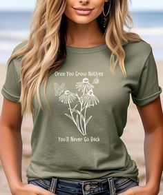 Native plants are where it's at! Spread the joy of planting native plants with this cute Once You Grow Natives You'll Never Go Back shirt! We love the quality and softness of these Bella Canvas shirts with unisex sizing, and we think you'll love them, too! Looking for more styles?  This is a link to our shop: https://www.etsy.com/shop/josephineandjean  Prefer Comfort Colors? We've got you covered. josephineandjeantoo.etsy.com The PRINT Our printer uses direct-to-garment printing to make our products. The design ink is sprayed on, then allowed to soak into the fibers of the garment resulting in fine quality prints and a smooth finish on the garment. SIZING AND COLORS * This unisex t-shirt feels like a well loved favorite.  * Women should buy their normal size or a smaller size for a more fi Green Plant Print Tops For Gardening, Green Tops With Plant Print For Gardening, Casual Green T-shirt For Gardening, Green Tops With Letter Print For Gardening, Casual Crew Neck T-shirt For Gardening, Gardening Shirts, Prism Color, Ash Color, Native Plants