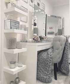 a white desk with a chair and mirror