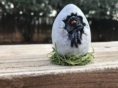 a close up of a rock with grass on it