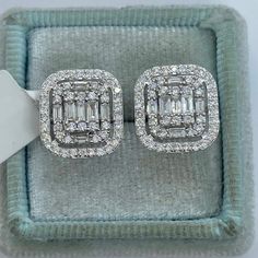 Classy Diamond Earrings Emerald Cut Halo Studs.  Nice size earrings you can dress up or down with.  Excellent craftsmanship, all diamonds are set smooth. Sits nice on the ear, the double halo of diamonds gives a lot of sparkles.  These square shapes are a bit different than your everyday round ones.  The screw backings are a secure fit.  Measures 13 x 12mm. These natural diamonds nice and sparkly.   Genuine Round and Baguette Cut Diamonds Total weight: 0.97 Carats  Clarity: SI/I Color: G All white and shiny diamonds, no cloudy or yellowish stones  Solid 14K White Gold   Comes with gift box #770PJ * We have been in the wholesale Jewelry business for over 30 years serving the community at the same location.  All diamonds we use are natural stones and fine quality gold.  Absolutely NO clarity Emerald Cut Diamond Earrings, Tina Snow, Square Diamond Studs, Square Diamond Earrings, Baguette Earrings, Morganite Wedding Rings, Emerald Cut Halo, Baguette Earring, Pink Morganite Engagement Ring