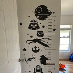 the star wars growth chart wall decal is on display in this child's room