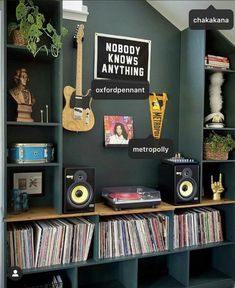 there are many bookshelves in this room with various items on the shelves and records