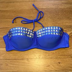 New With Tags. This Blue Studded Bikini Top Is Perfect For Summer! Its Ties In The Back. The Neck Strap Is Removable To Make It Strapless And Also Ties To Adjust Length. It’s Never Been Worn And In Perfect Condition! Blue Strapless Swimwear For Beach Party, Blue Tankini For Beach Season Party, Strapless Blue Tankini For Beach Party, Blue Summer Party Tankini, Summer Party Blue Tankini, Blue Strapless Swimwear For Party, Strapless Blue Swimwear For Party, Blue Strapless Tankini For Pool, Blue Bandeau Swimwear For Party