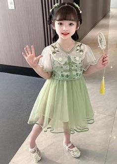 This stunning summer dress features a beautiful green V-neckline, intricate embroidery, and delicate tulle patchwork, making it an exquisite addition to your little girl's wardrobe. Perfect for any occasion, this dress exudes effortless elegance and... Long Dresses Summer, Kids Maxi, Cotton Dresses Summer, Girls Long Dresses, Cropped Linen Pants, Slides Women, Girls Dresses Summer, Girls Wardrobe, Long Summer Dresses