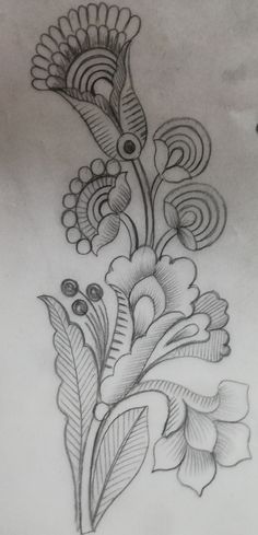 a drawing of flowers with leaves and swirls on the back of a woman's stomach