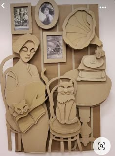 an art work made out of cardboard with pictures on it