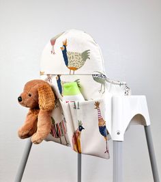 a stuffed animal sitting on top of a chair