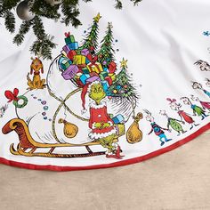 a christmas tree skirt hanging on the wall