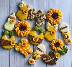 decorated cookies arranged in the shape of sunflowers on a wooden table with words happy birthday