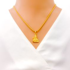 This high-finish pendant, exquisitely crafted from 22k gold and weighing 3.9 grams, showcases Lord Murugan in a radiant yellow gold finish. The pendant, with a length of 1 inch, symbolizes strength, wisdom, and purity. Ideal for those who hold spiritual values close to their hearts, this Lord Murugan pendant blends divine inspiration with exceptional artistry, making it a precious addition to any jewelry collection, embodying both cultural depth and immaculate design. PRODUCT DETAILS Gold Purity(karat): 22k Gold Weight(grams): 3.9 Item Finish: Yellow Gold Pendant Length: 1" Chain: Not Included Murugan Pendant Gold, Yellow Gold Pendant Necklace For Puja, Lord Krishna Pendant Gold, 22k Yellow Gold Temple Necklace Amulet, Lord Shiva Gold Pendant, Bridal Jewelry Necklace, Lord Murugan, Precious Stones Rings, Spiritual Values