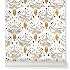 an art deco style wallpaper with gold and white fan design on it's back