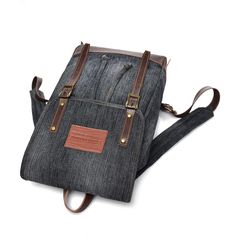 This fashionable backpack for casual use is crafted from high-class genuine denim cloth and polyester lining that features a unique design. This bag is very stylish, perfect for men, and has undergone the latest embossing technique. It has a hard handle and softback design, making it comfortable to carry. It has an interior compartment, zipper and slot pocket, and an arcuate shoulder strap carrying system.  Product highlights:   Light to carry with a durable and soft strap  Available in 4 shades of vintage color designs  With magnetic snap closure type  Bag dimension: 40cm x 12cm x 25cm  Capacity: 20 to 35 Litre Denim Backpack With Large Capacity For Travel, Large Capacity Denim Backpack For Everyday Use, Travel Denim Backpack, Casual Leather Backpack With Zipper Pocket, Denim Travel Backpack, Black Cotton Backpack With Pockets, Black Denim Travel Bag, Black Canvas Backpack With Zipper Pocket, Casual School Backpack With Canvas Lining