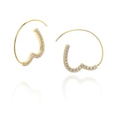 PRICES MAY VARY. Stunning pair of statement pull-through hoop earrings, where trendy fashion meets timeless elegance. These earrings are designed to be a true head-turner, and easy to match, effortlessly elevating your style with their unique and captivating design. These half hoop C shaped earrings feature a gracefully curved gold bar in the shape of a delicate heart, adorned with dainty, sparkling rhinestone cubic zirconia, that gently sway and dance around your face, catching the light with every movement, pretty and charming for any occasions. The 14k gold plating adds a touch of luxury and glamour, enhancing the overall allure of these earrings. The pull-through hoop design offers a modern twist and ensures a comfortable minimal and secure fit, allowing you to showcase your style with Valentine's Day Heart Shaped Fine Hoop Earrings, Modern Yellow Gold Cubic Zirconia Hoop Earrings, Gold Rhinestone Hoop Earrings, Glamorous Rhinestone Hoop Earrings, Polished Fashion, Gold Heart-shaped Hoop Earrings For Valentine's Day, Teardrop Hoop Earrings, Heart Hoop Earrings, Hoop Design