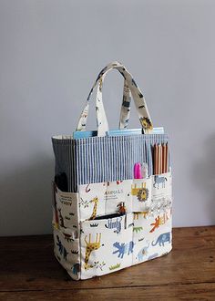 a tote bag sitting on top of a wooden table