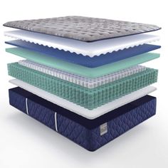 four mattresses stacked on top of each other in different colors and sizes, with the bottom layer folded down