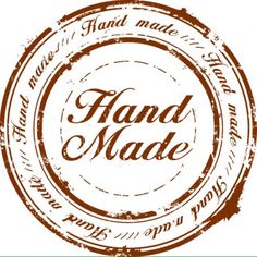 a stamp with the words hand made written in brown and white ink on top of it