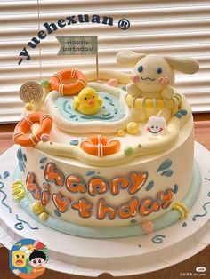 a birthday cake with an image of a baby in the bathtub and rubber ducks