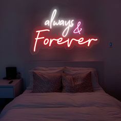 there is a neon sign that says always and forever on the wall above the bed