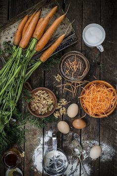 carrots and other ingredients on a wooden table