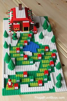 a lego christmas scene with a house and trees