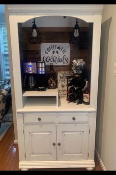 a white hutch with some items on it