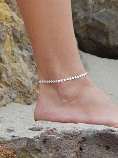 This Sterling Silver Coin Anklet is an elegant addition to any outfit. The solid sterling silver discs make for a striking look that will get noticed. Whether you pair it with sandals at the beach or dress it up with your favorite shoes, it is sure to turn heads. ● 925 Sterling Silver Elegant Silver Barefoot Sandals For Summer, Elegant Silver Anklets For The Beach, Silver Elegant Barefoot Sandals For Festivals, Elegant Silver Barefoot Sandals For Festivals, Silver Barefoot Sandals For Summer Gift, Sterling Silver Anklets For Summer Gifting, Sterling Silver Anklets For Summer, Silver Adjustable Anklets For The Beach, Adjustable Silver Anklets For Beach