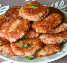 there is a plate full of crab cakes on the table