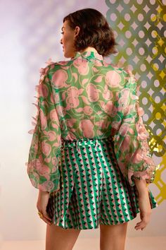 Green and pink sheer bomber jacket, hand embellished with floral appliques and geometric motifs. Comes with an inner. 
Component: 2
Pattern: Embellished
Type Of Work: Floral Appliques
Neckline: Band Collar
Sleeve Type: Puff Sleeves
Fabric: Organza
Color: Green, Pink
Other Details: 
Sheer jacket
Front zipper
Floral appliques
Note: The skirt and belt worn by the model is not for sale
Occasion: Party - Aza Fashions Pink Embellished Spring Outerwear, Summer Long Sleeve Embellished Outerwear, Embellished Long Sleeve Summer Outerwear, Floral Print Long Sleeve Outerwear For Party, Spring Party Outerwear With Sheer Sleeves, Pink Embellished Long Sleeve Outerwear, Floral Print Outerwear For Party, Floral Print Party Outerwear, Designer Spring Party Blouse