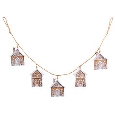 a gold necklace with five small houses hanging from it's sides, on a white background