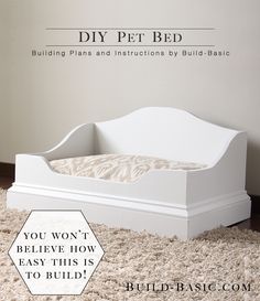 a white dog bed sitting on top of a rug next to a wall with the words diy pet bed written above it