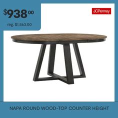 a round wooden table with metal legs and a price tag for $ 399 00