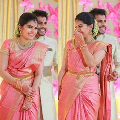 a man and woman standing next to each other in pink sari with gold accents