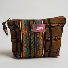 Packing is a breeze with the Kente Kumas Carry All Pouch. This limited-edition sack has a zip enclosure and is made from traditional African print fabric. The large has enough space to hold your pre-flight essentials when dashing out to the airport but is small enough to function as a clutch in casual settings. Use the smaller size to hold on-the-go makeup essentials, that loose change floating around your purse, and hair accessories. Choose from the large, the small, or get the set for coordina Sleeve Holders, Flight Essentials, Loose Change, African Print Fabric, Essential Bag, Carry All Bag, Makeup Essentials, Sewing Bag, Print Fabric