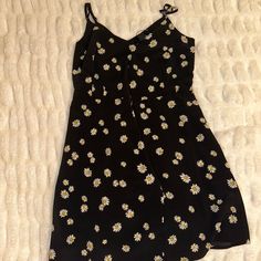 Wrap Dress That Is In Brand New Condition. This Item Has Never Been Worn. Bought Item For 99 Usd, But Price Is Negotiable. Cute Black Sleeveless Mini Dress, Black Casual Sundress For Spring, Casual Black Sundress For Spring, Summer Daisy Print Mini Dress For Brunch, Summer Mini Dress With Daisy Print For Brunch, Cute Black Dress For Brunch, Casual Sleeveless Daisy Print Dress, Daisy Print Sundress For Day Out, Casual Black Sundress For Day Out