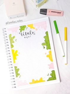 a notepad with writing on it next to pens and other items that include markers