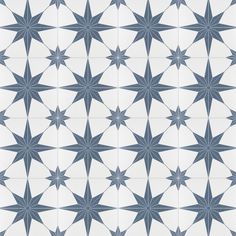 an image of a star pattern in blue and white colors on a tile wall or floor