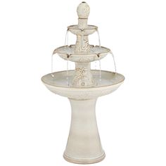 a white water fountain with three tiers